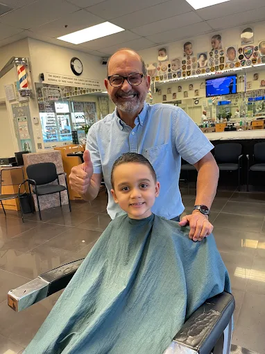 Barber Ron with happy young client